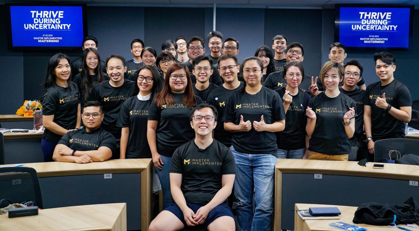 The Master Implementers mastermind cohort in black MI shirts, 2022.