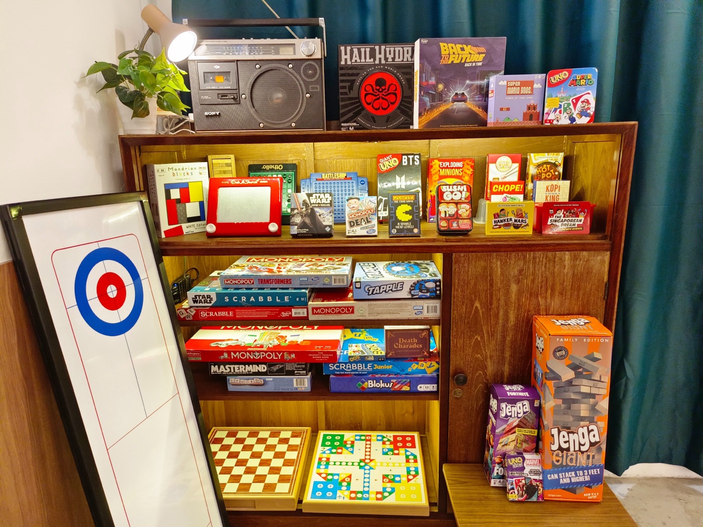 The board games shelf at room2f.